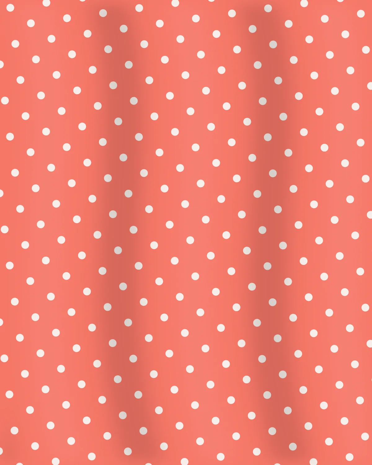 Fabric detail of the Coral Polka Wrap Dress